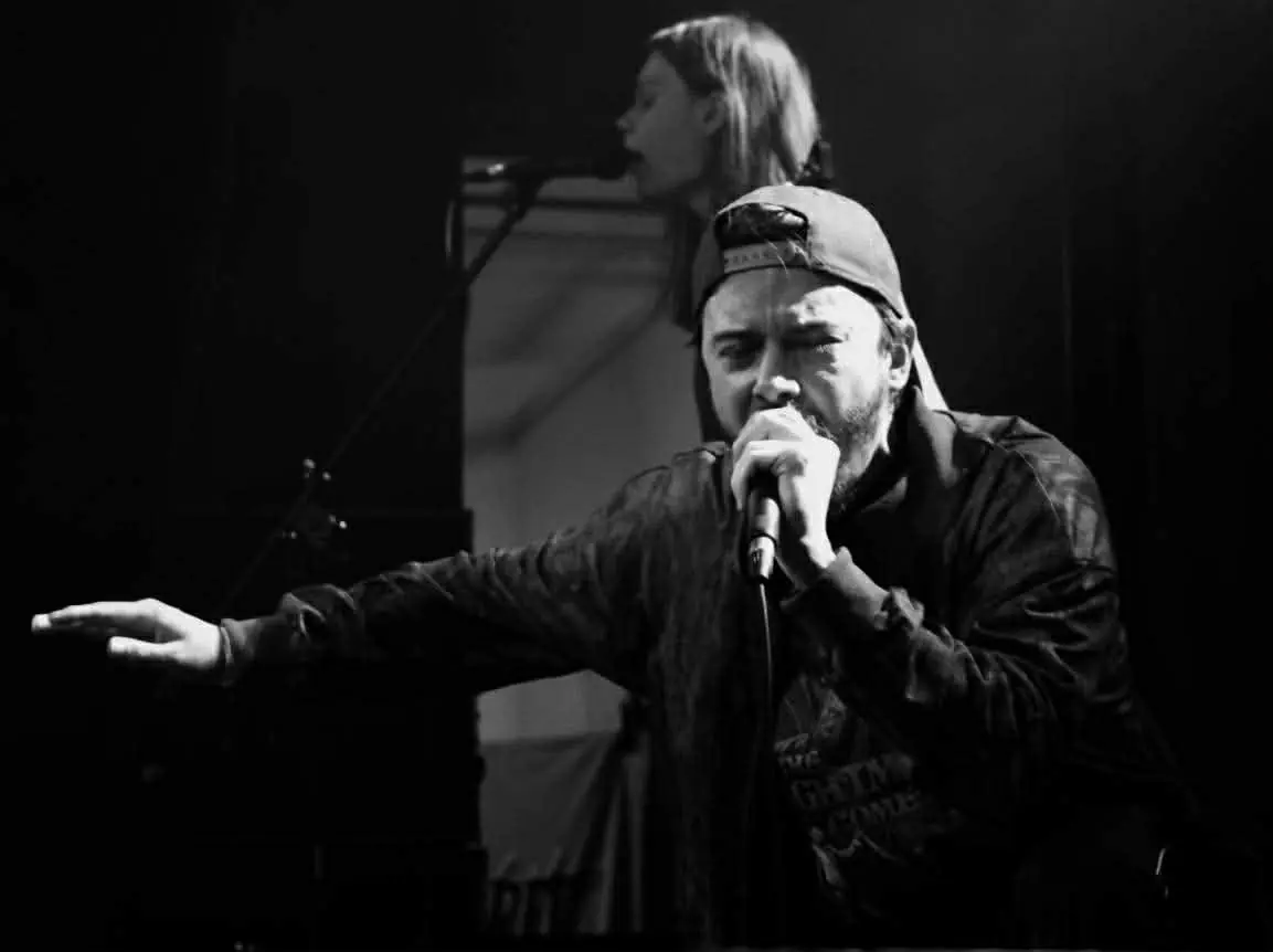 Vocalist singing into the microphone, black and white